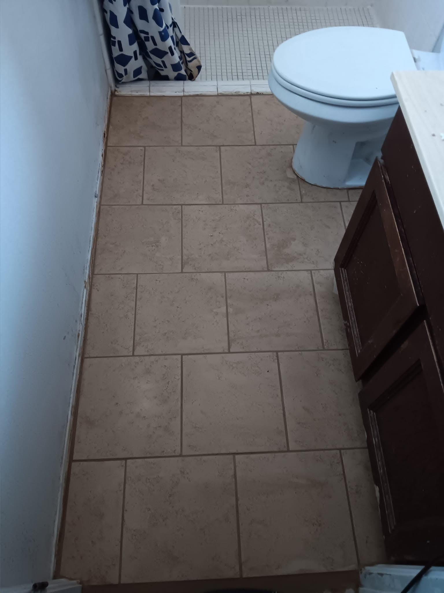 After: bathroom with a completed rectangular tile floor