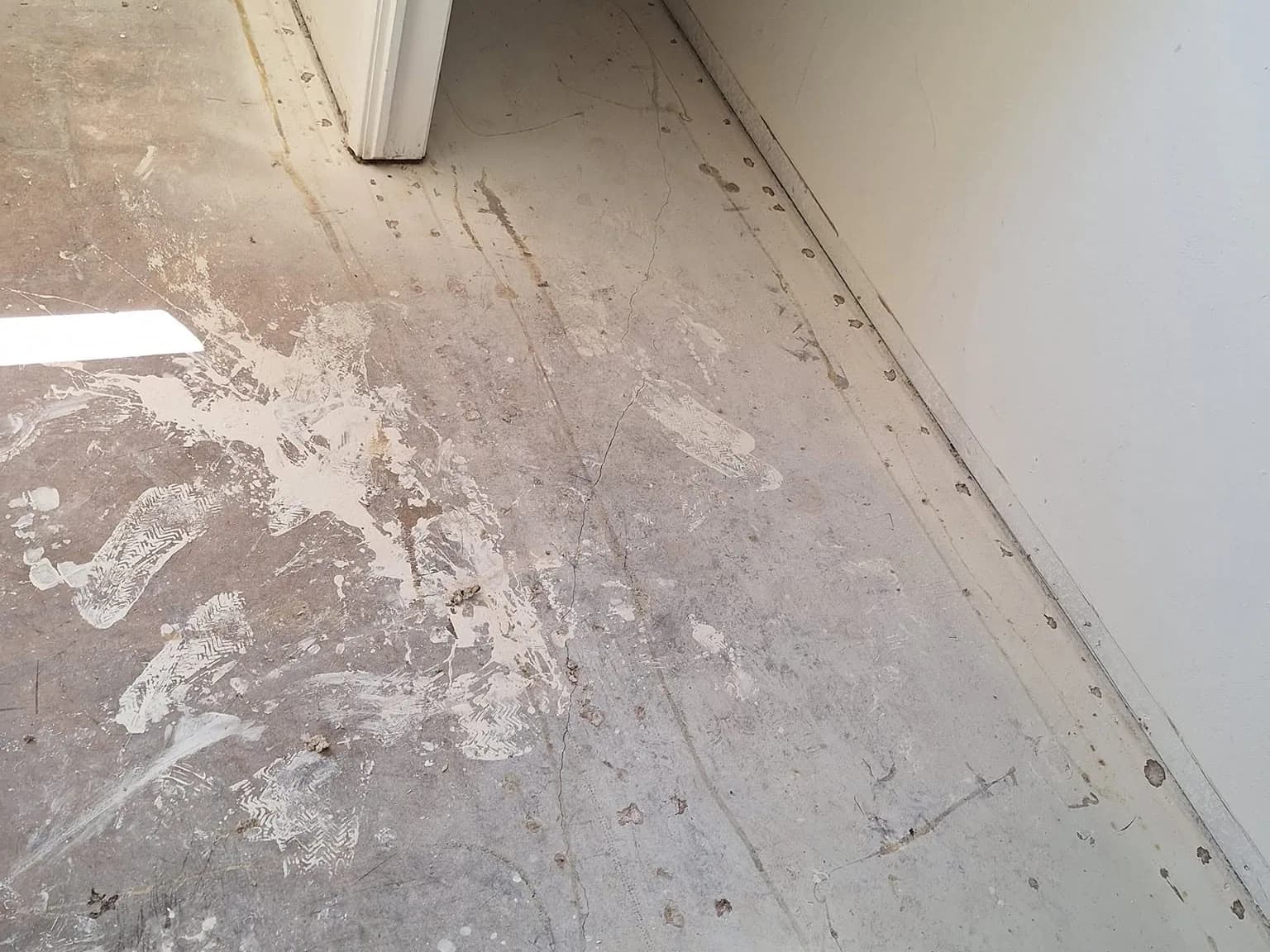 Before: exposed bedroom floor prior to the flooring update