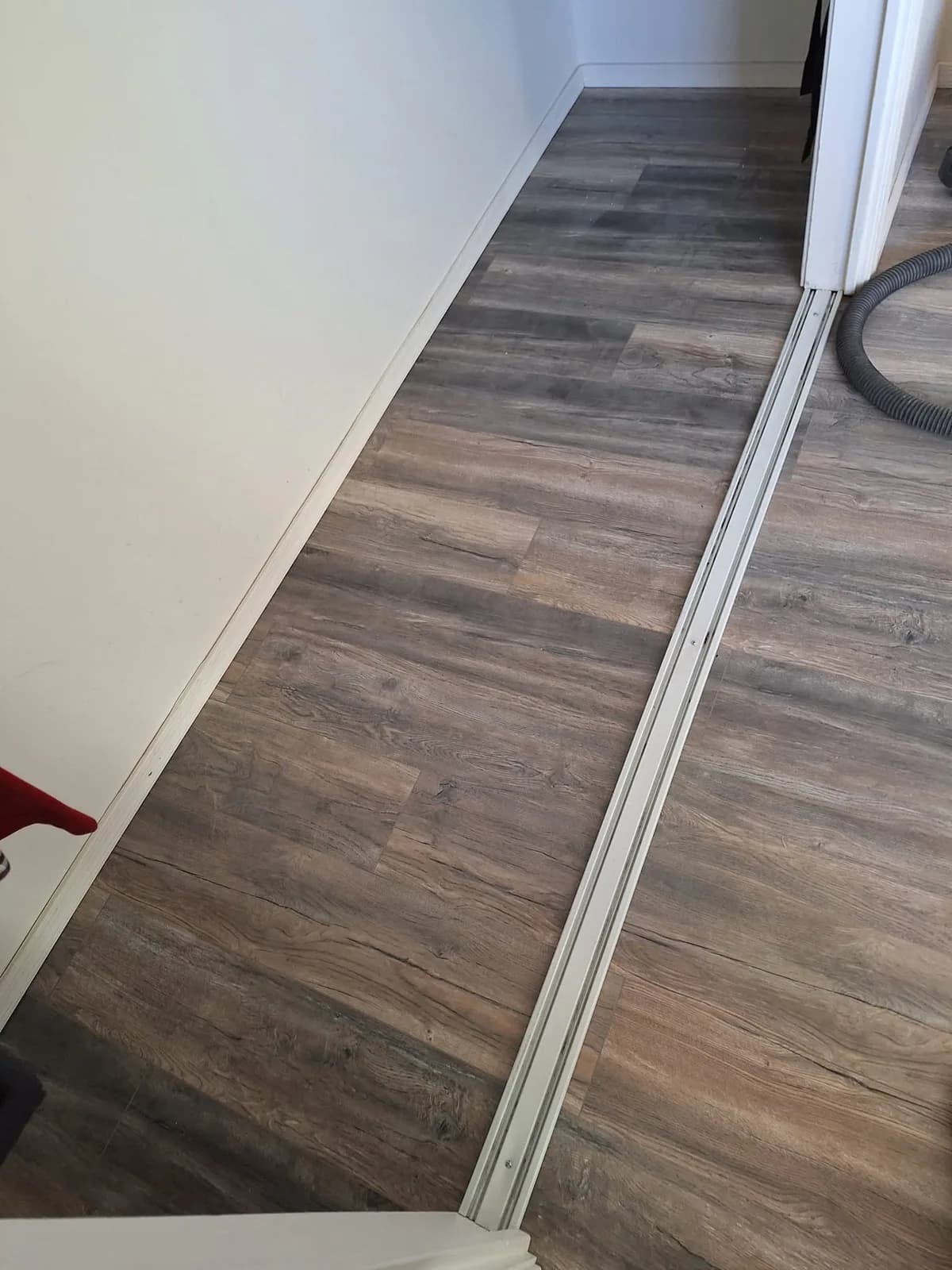Finished plank flooring at a doorway transition