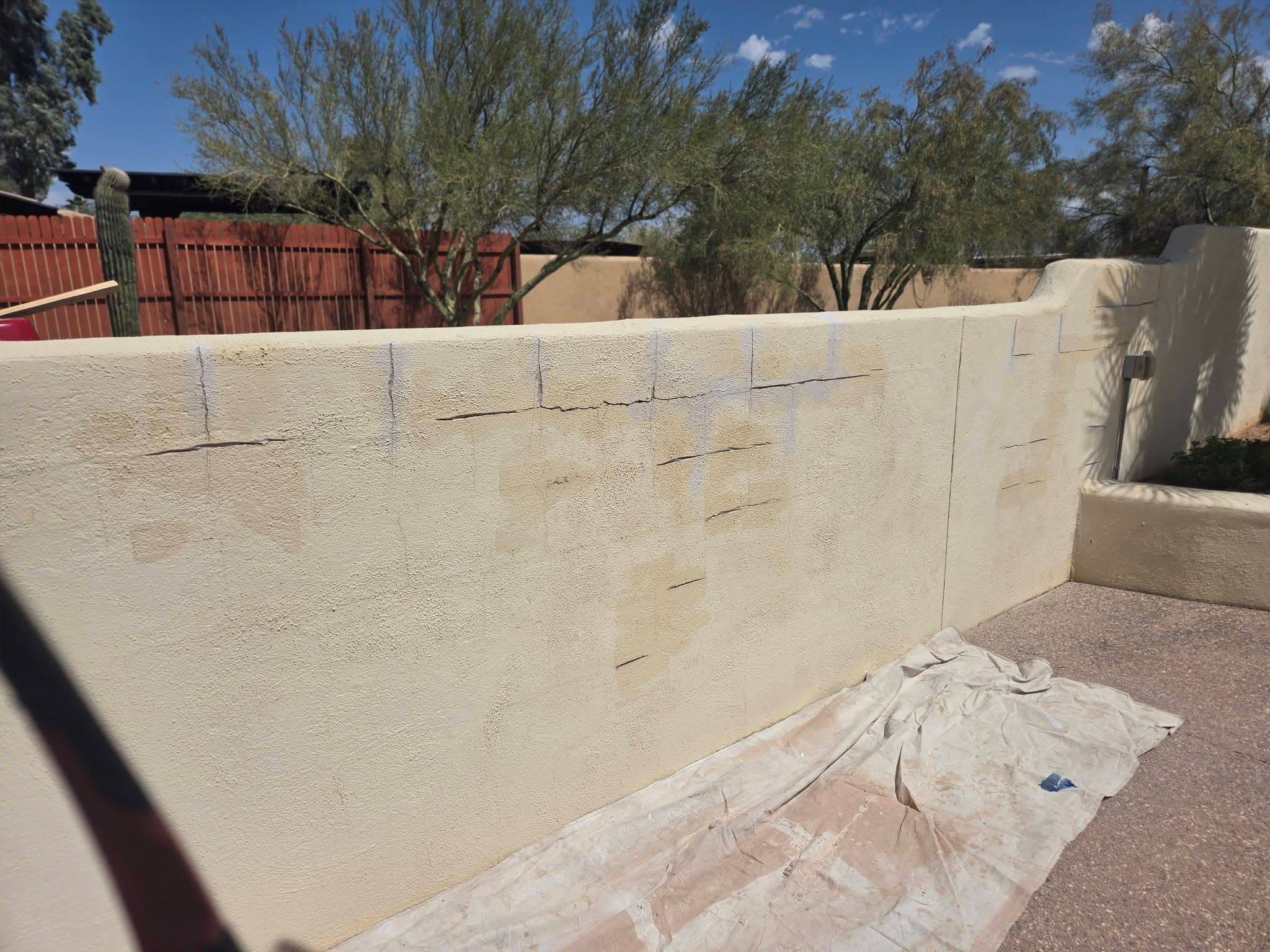 During: repair coating being applied across the block wall surface