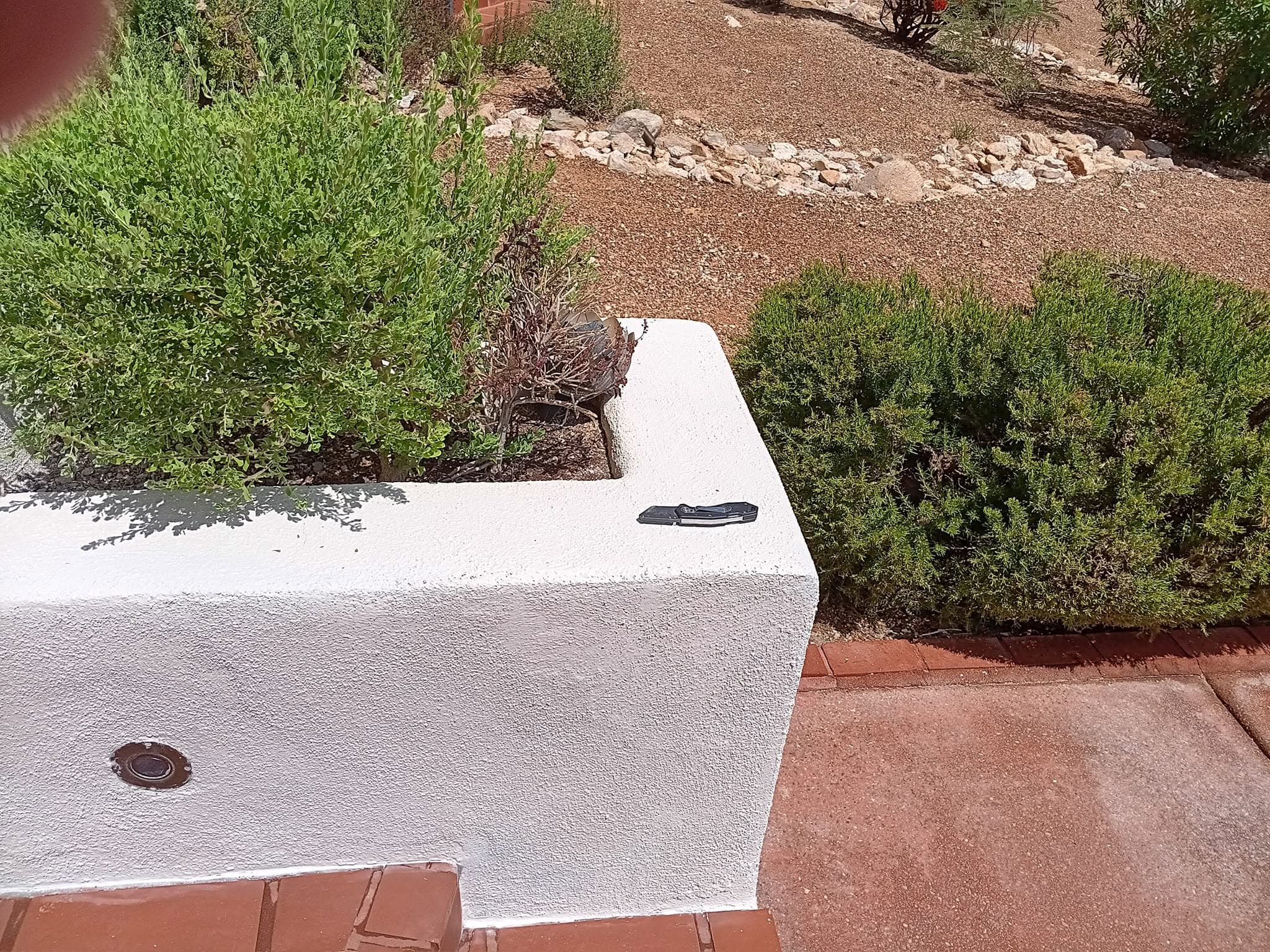 After: entry wall and pillar with an even white finished surface