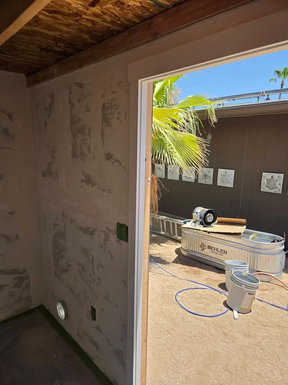 Shed interior with unfinished wall and ceiling surfaces